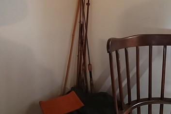 Rybářské pruty a židlička J. Kronera.